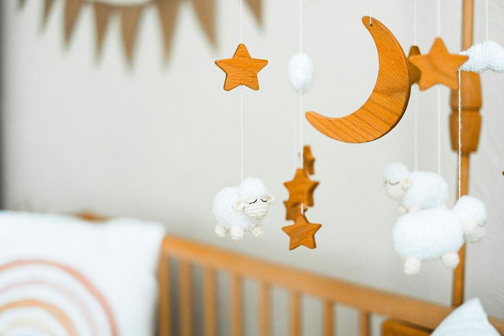 star and moon mobile over baby cot Pexels shvetsa 11369154